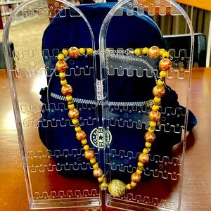 Coopers and gold plate bead with tinny tiger eyes. Approximately 18 inches.